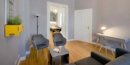 main living room and bedroom in family plus apartment at OTA-Berlin