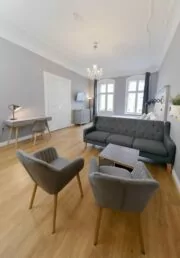 main living room and bedroom in family plus apartment at OTA-Berlin