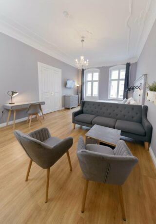 main living room and bedroom in family plus apartment at OTA-Berlin
